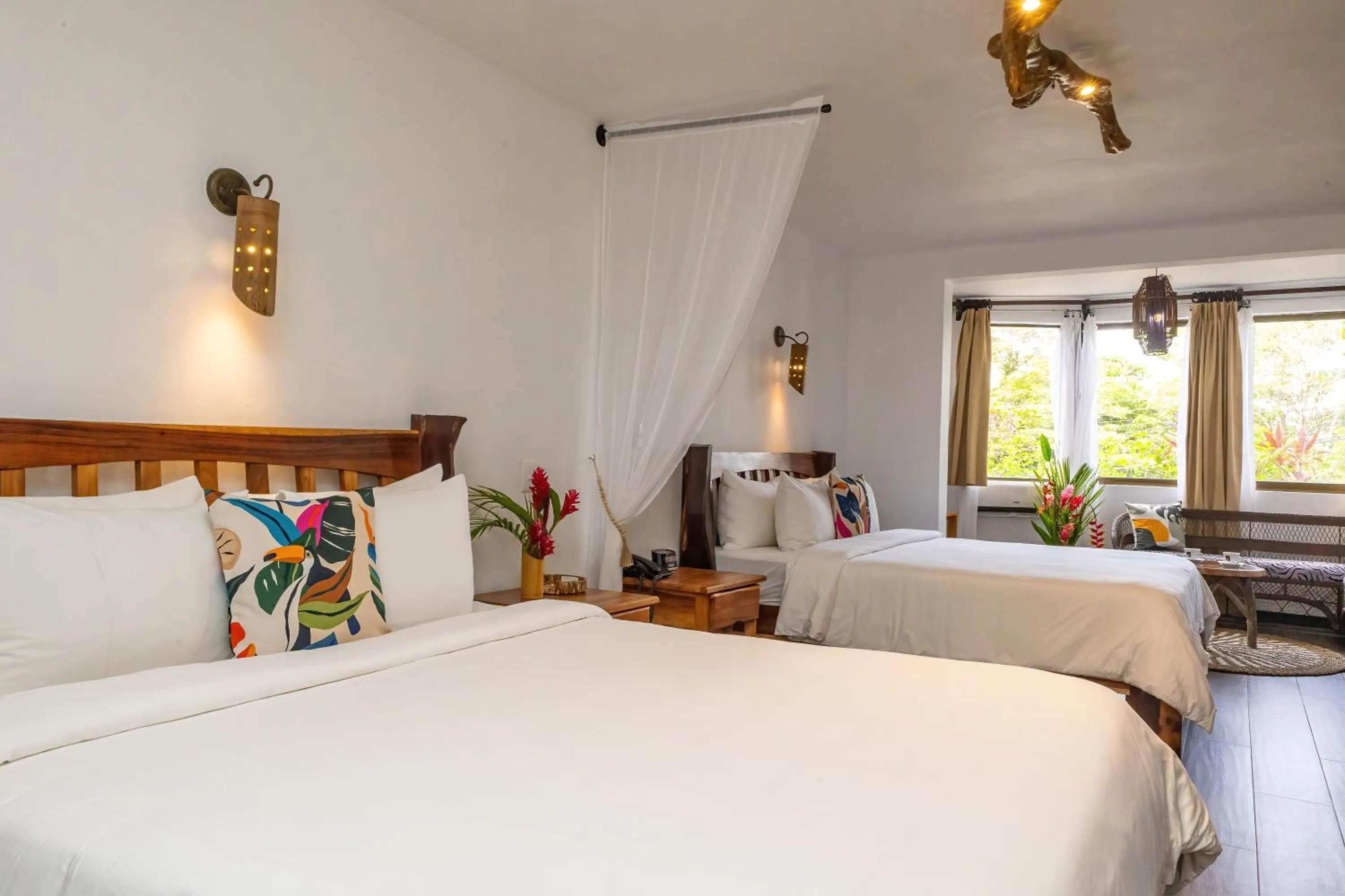 Bed in ECOTICA Boutique Hotel