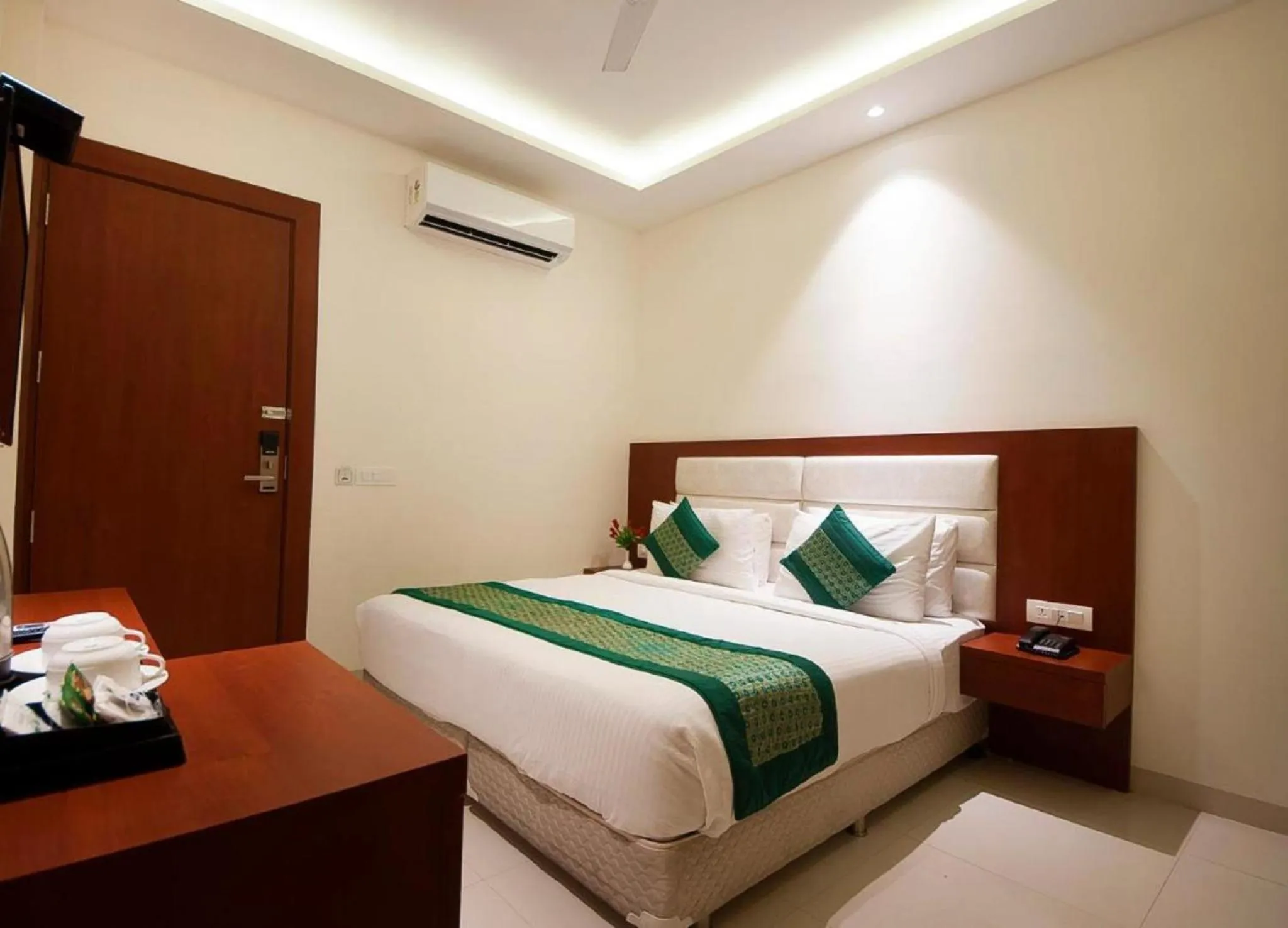air conditioner, Bed in Hotel Z Suites with FREE Airport Drop