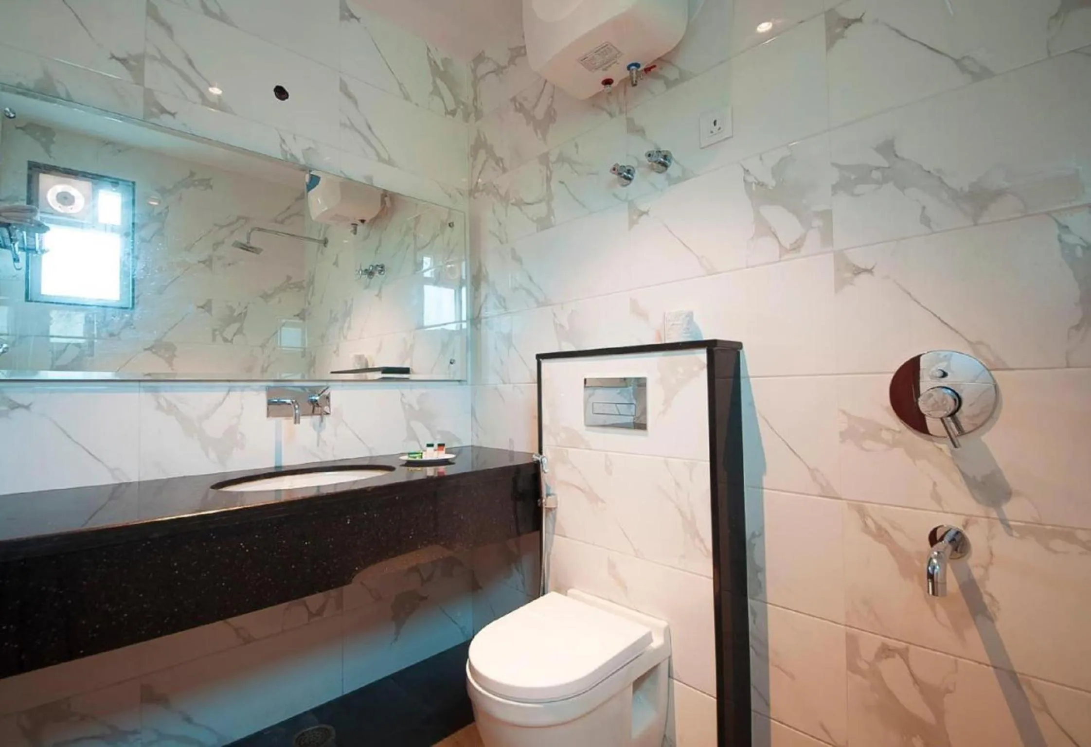 Shower in Hotel Z Suites with FREE Airport Drop