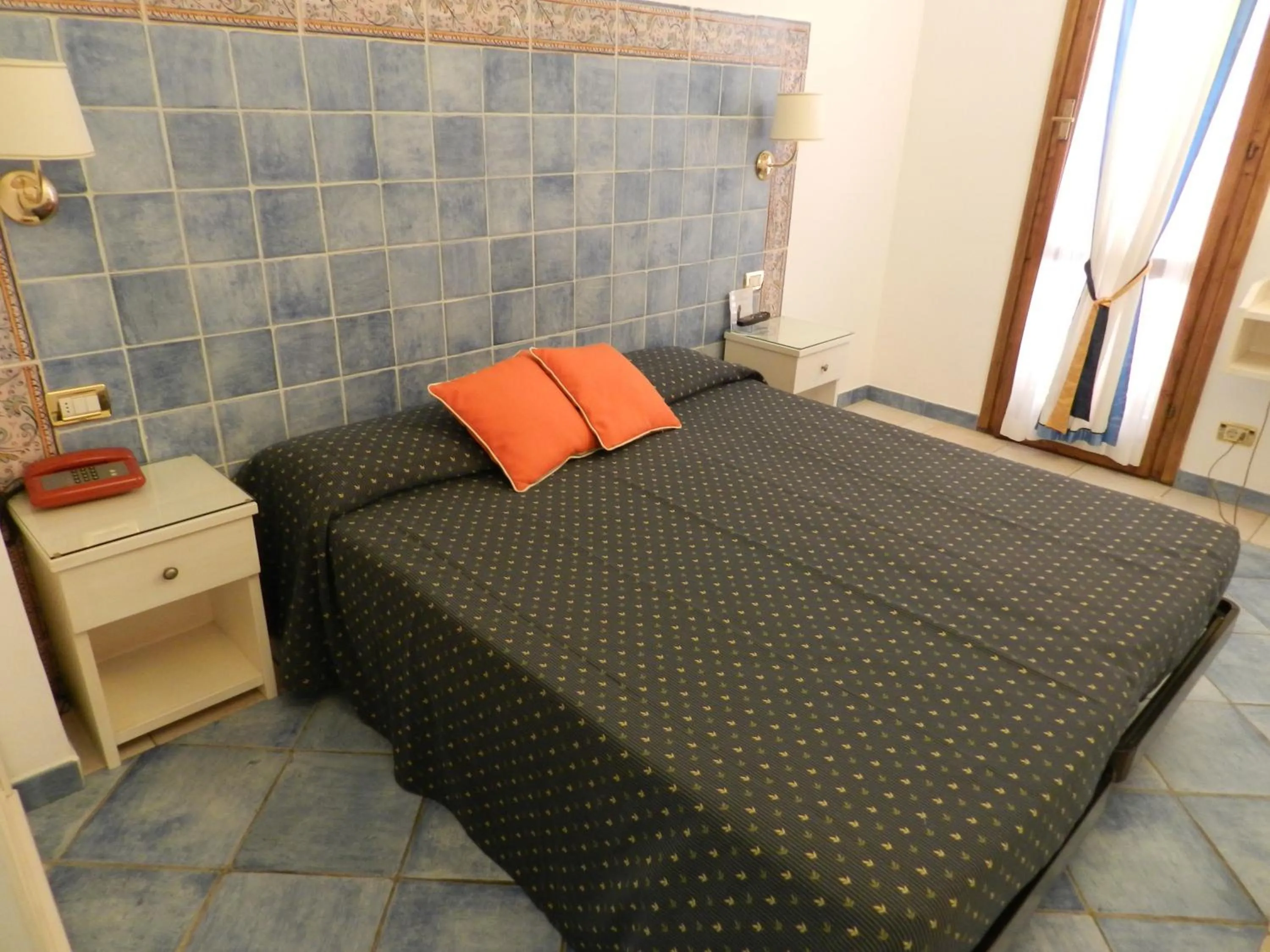 Decorative detail, Bed in Hotel Punta Mesco