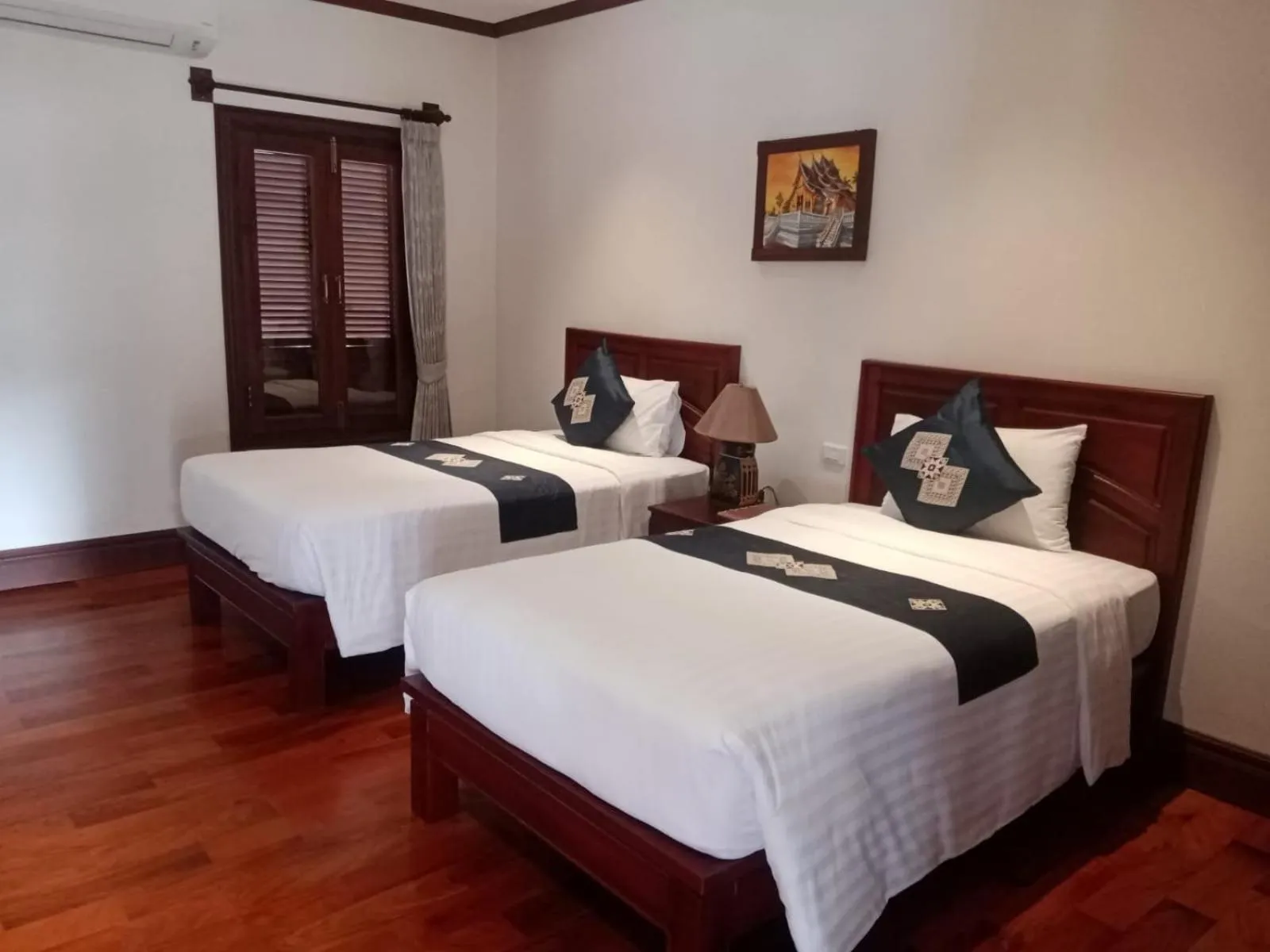 Bed in Houngvilai Hotel