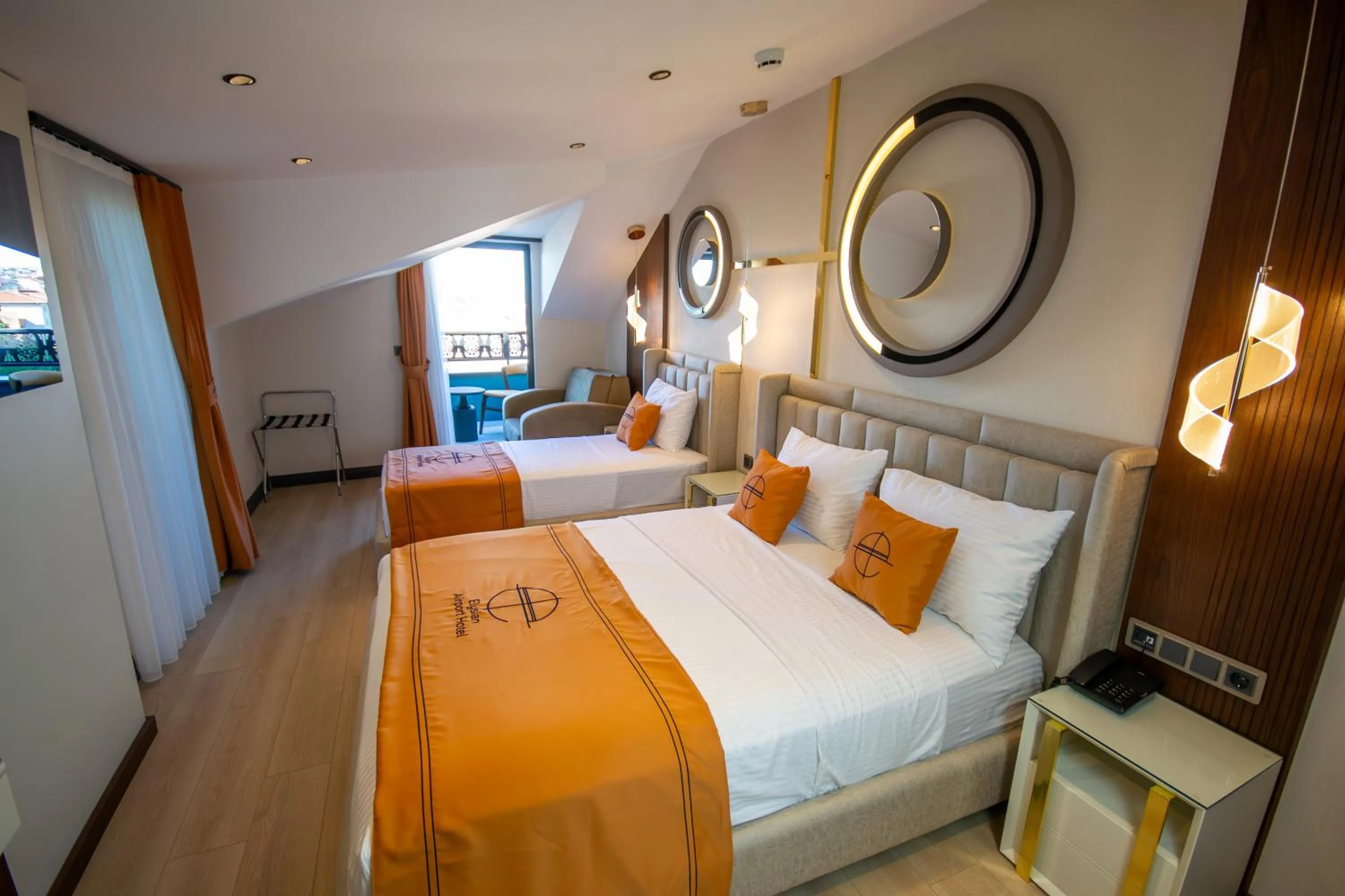 Bed in Elysian Airport Hotel & Restaurant