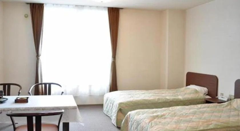 Bed in Ryobou Hanaemi Hotel