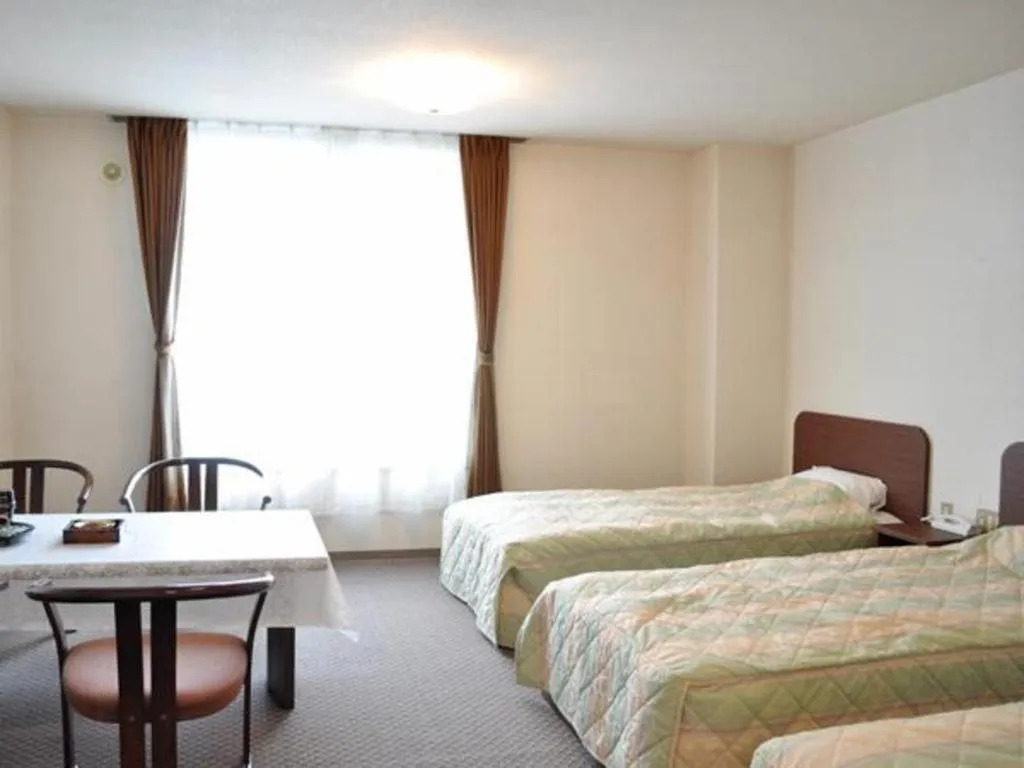 Bed in Ryobou Hanaemi Hotel