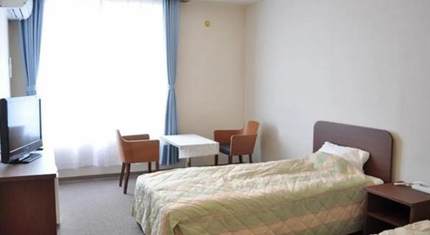 Bed in Ryobou Hanaemi Hotel