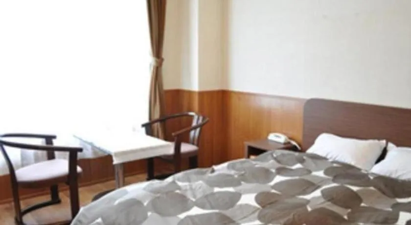 Bed in Ryobou Hanaemi Hotel