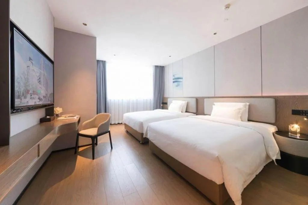 Bed in Yian Business Hotel