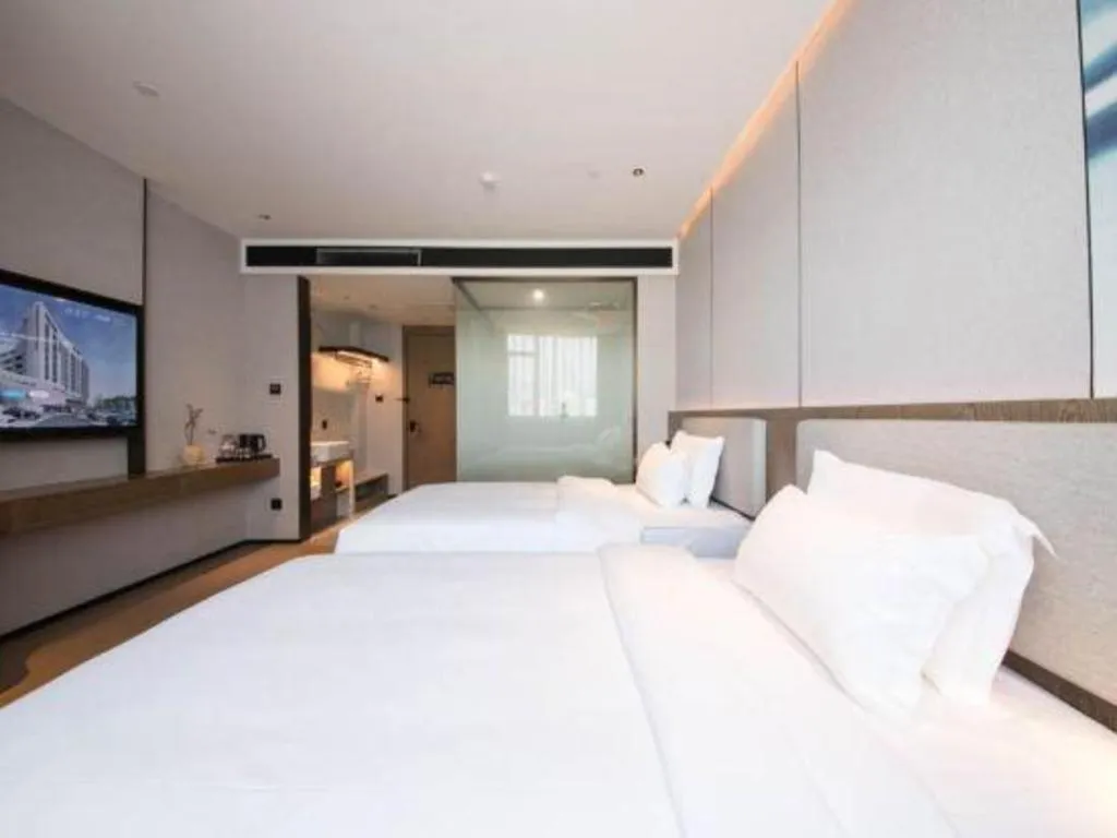 Bed in Yian Business Hotel