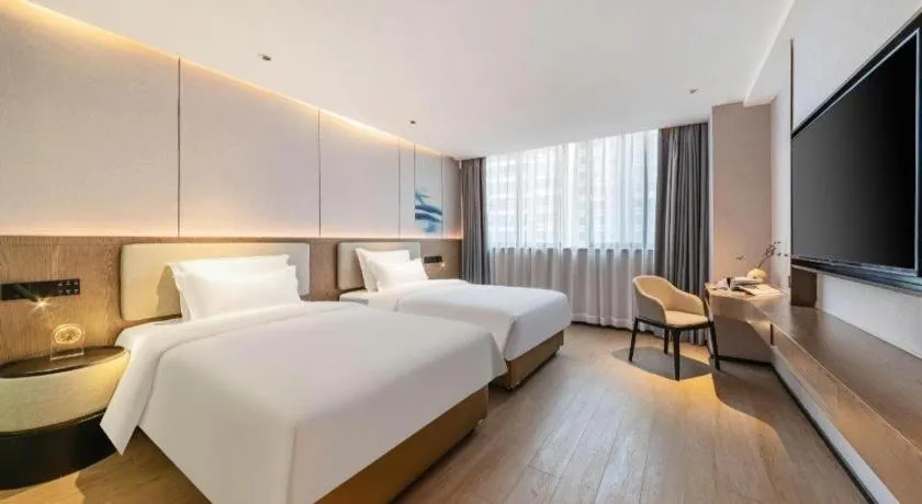 Bed in Yian Business Hotel