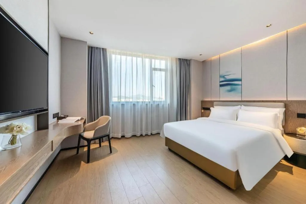 Bed in Yian Business Hotel