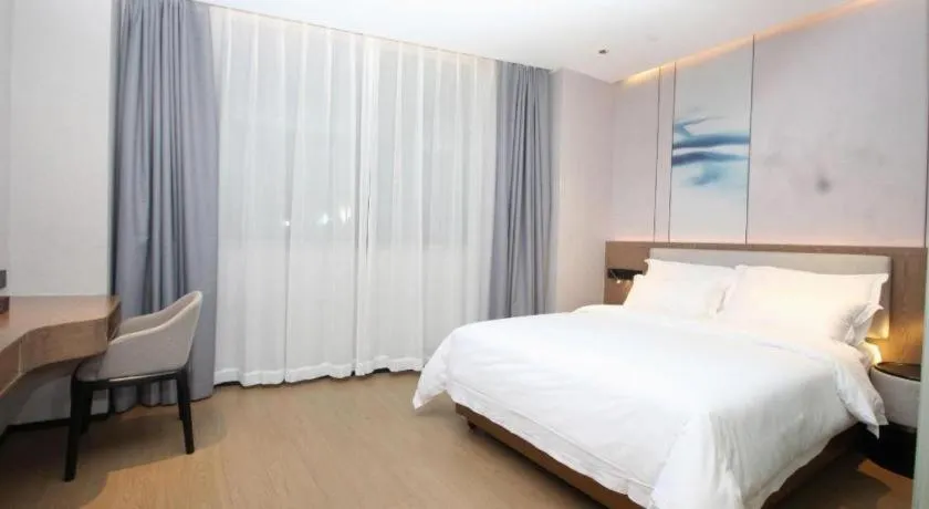 Bed in Yian Business Hotel