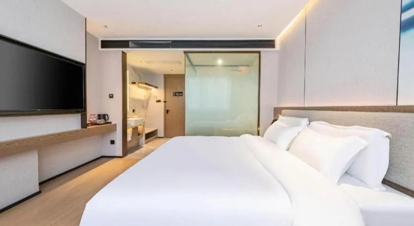 Bed in Yian Business Hotel