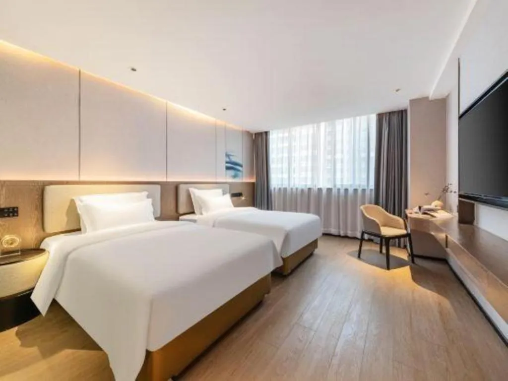 Bed in Yian Business Hotel