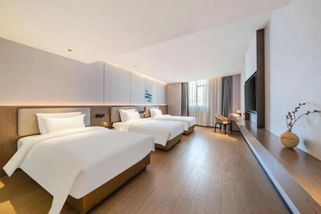 Bed in Yian Business Hotel