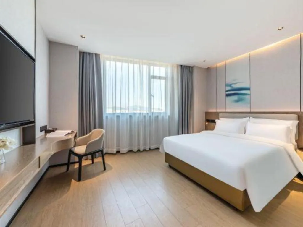 Bed in Yian Business Hotel