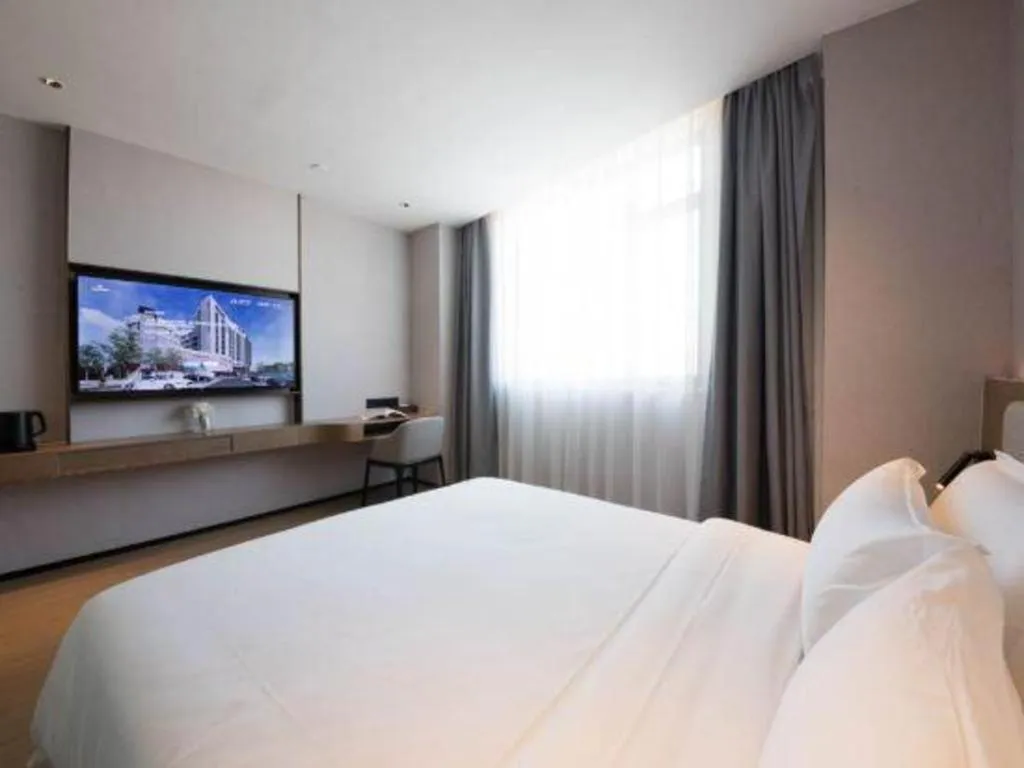 Bed in Yian Business Hotel