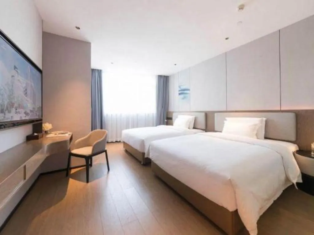 Bed in Yian Business Hotel