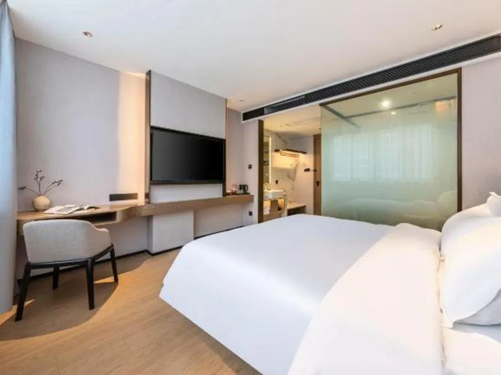 Bed in Yian Business Hotel