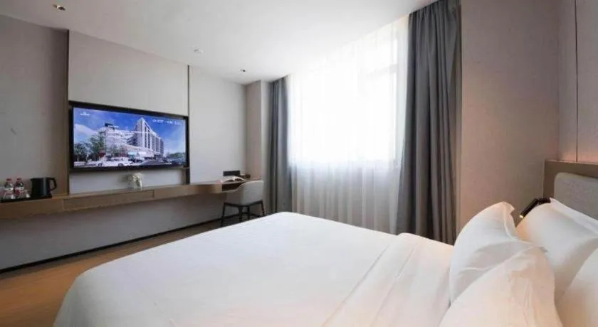 Bed in Yian Business Hotel