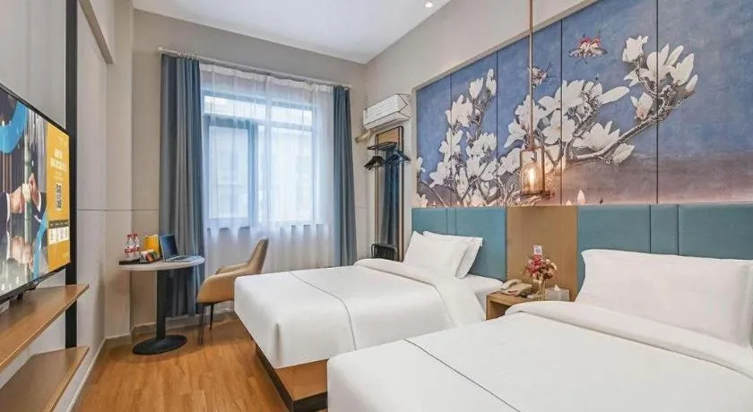 Bed in Jinjiang Inn Wuxi Liangqing Road Wanda Plaza Yunhe Bay Industrial Center