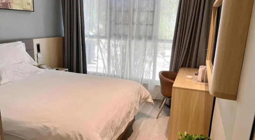 Bed in Jinjiang Inn Wuxi Liangqing Road Wanda Plaza Yunhe Bay Industrial Center