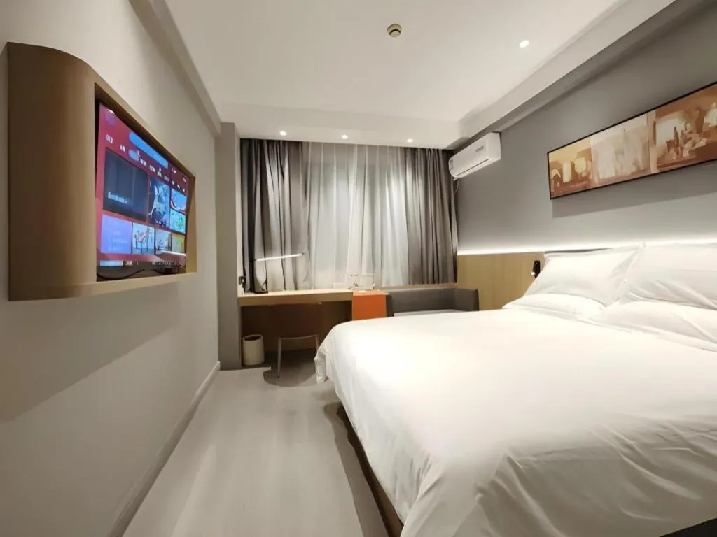Bed in Jinjiang Inn Wuxi Liangqing Road Wanda Plaza Yunhe Bay Industrial Center