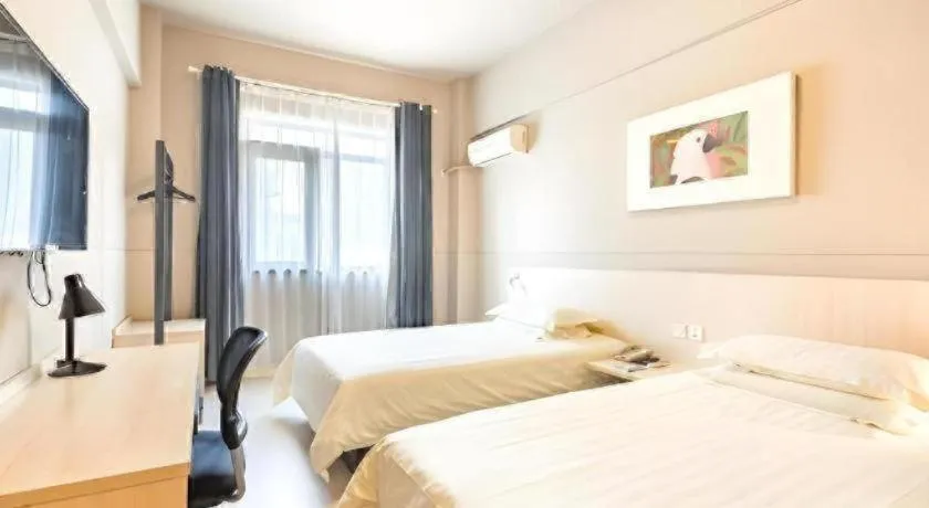 Bed in Jinjiang Inn Wuxi Liangqing Road Wanda Plaza Yunhe Bay Industrial Center