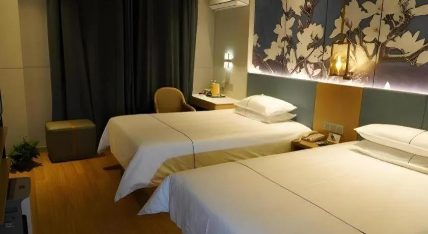 Bed in Jinjiang Inn Wuxi Liangqing Road Wanda Plaza Yunhe Bay Industrial Center