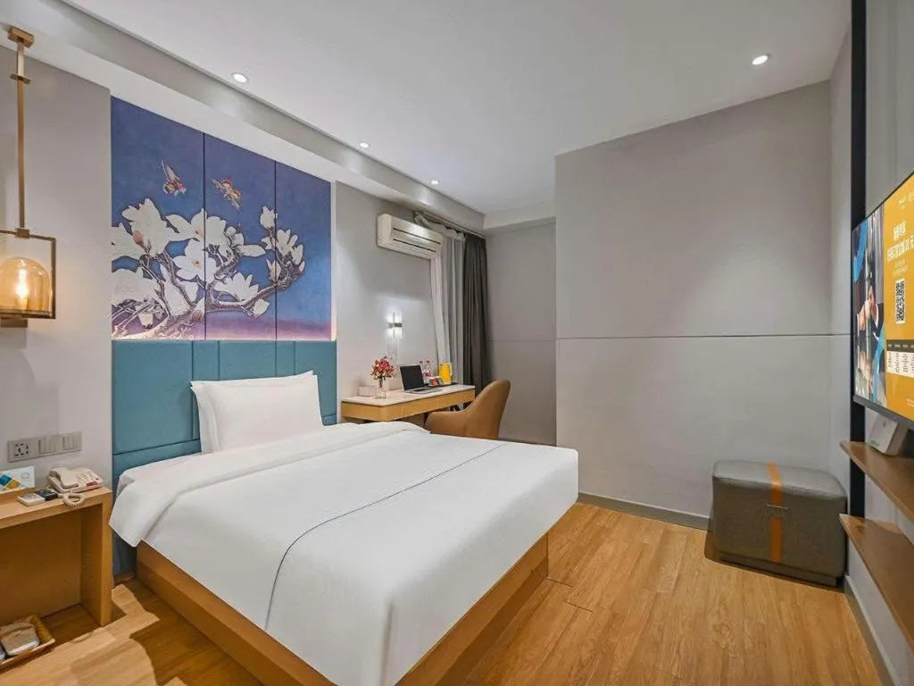 Bed in Jinjiang Inn Wuxi Liangqing Road Wanda Plaza Yunhe Bay Industrial Center
