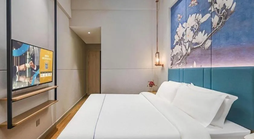 Bed in Jinjiang Inn Wuxi Liangqing Road Wanda Plaza Yunhe Bay Industrial Center