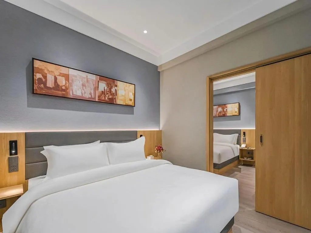 Bed in Jinjiang Inn Wuxi Liangqing Road Wanda Plaza Yunhe Bay Industrial Center