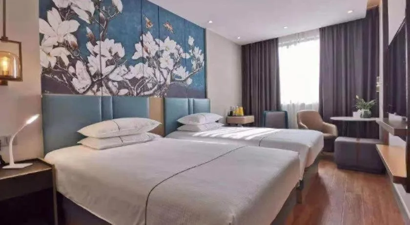 Bed in Jinjiang Inn Wuxi Liangqing Road Wanda Plaza Yunhe Bay Industrial Center