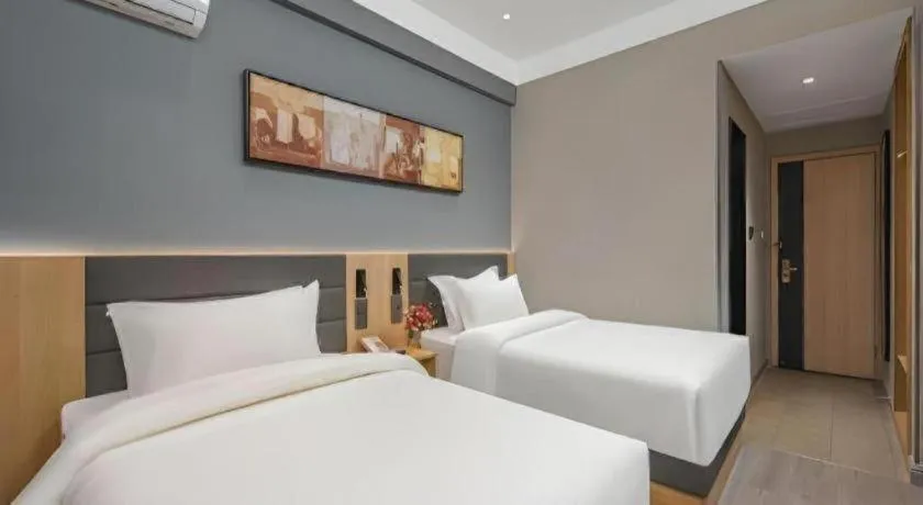 Bed in Jinjiang Inn Wuxi Liangqing Road Wanda Plaza Yunhe Bay Industrial Center