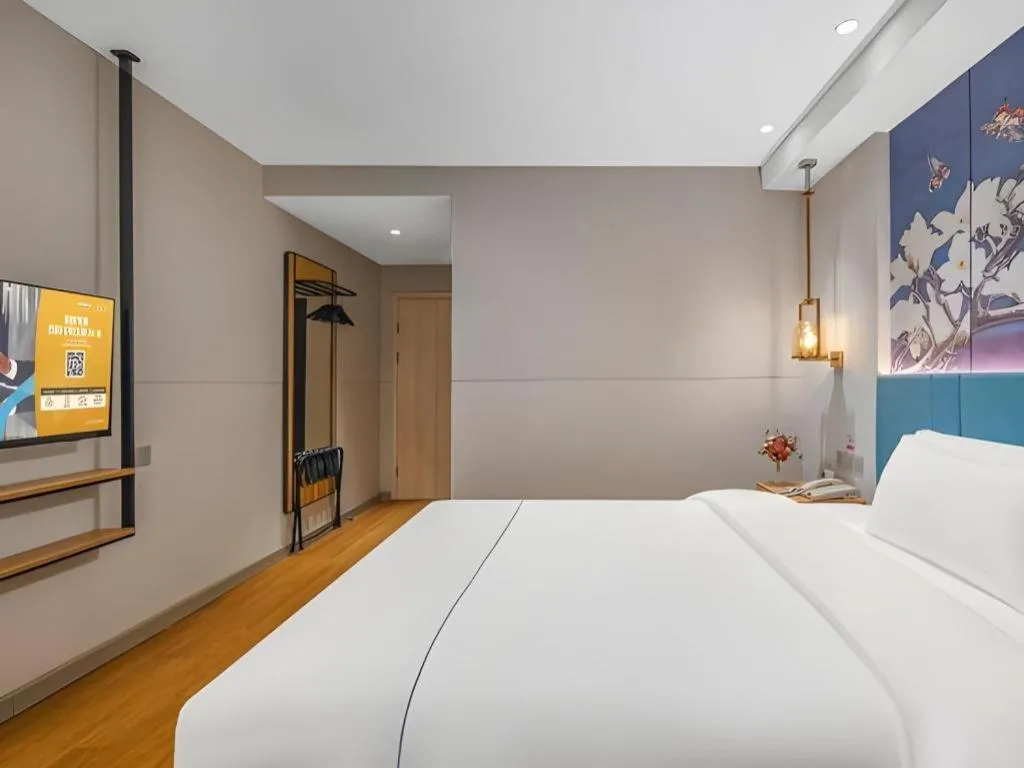 Bed in Jinjiang Inn Wuxi Liangqing Road Wanda Plaza Yunhe Bay Industrial Center