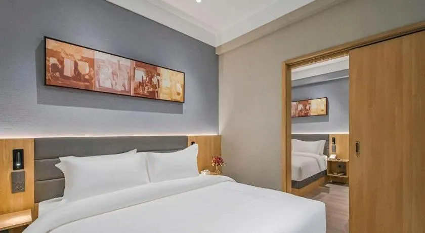 Bed in Jinjiang Inn Wuxi Liangqing Road Wanda Plaza Yunhe Bay Industrial Center
