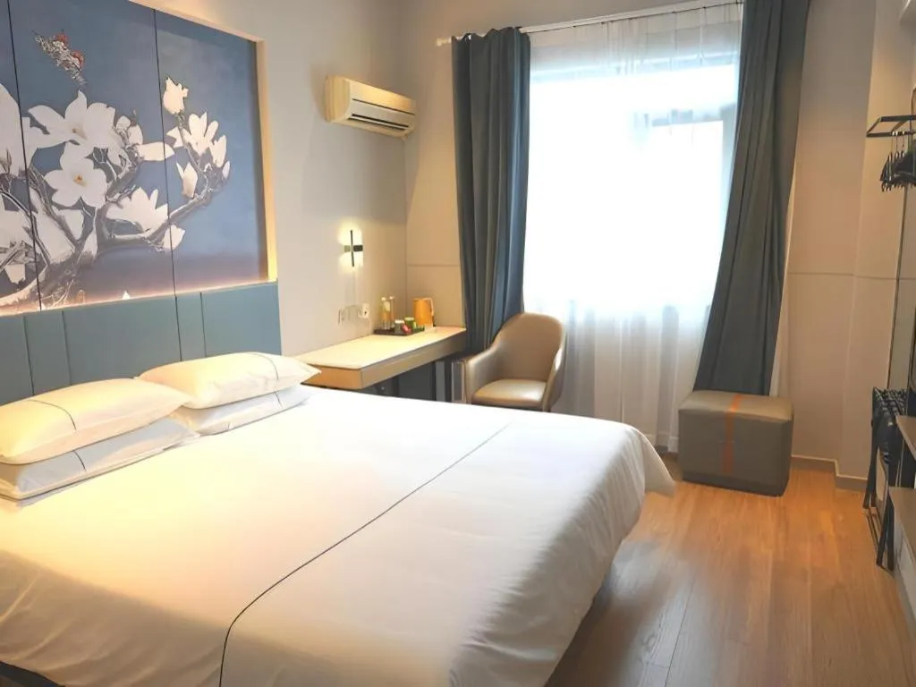 Bed in Jinjiang Inn Wuxi Liangqing Road Wanda Plaza Yunhe Bay Industrial Center