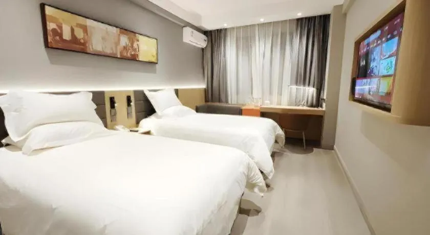 Bed in Jinjiang Inn Wuxi Liangqing Road Wanda Plaza Yunhe Bay Industrial Center