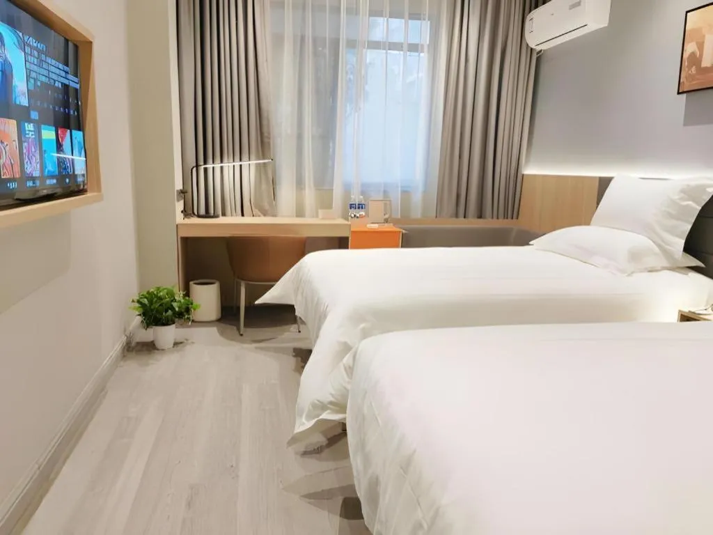 Bed in Jinjiang Inn Wuxi Liangqing Road Wanda Plaza Yunhe Bay Industrial Center