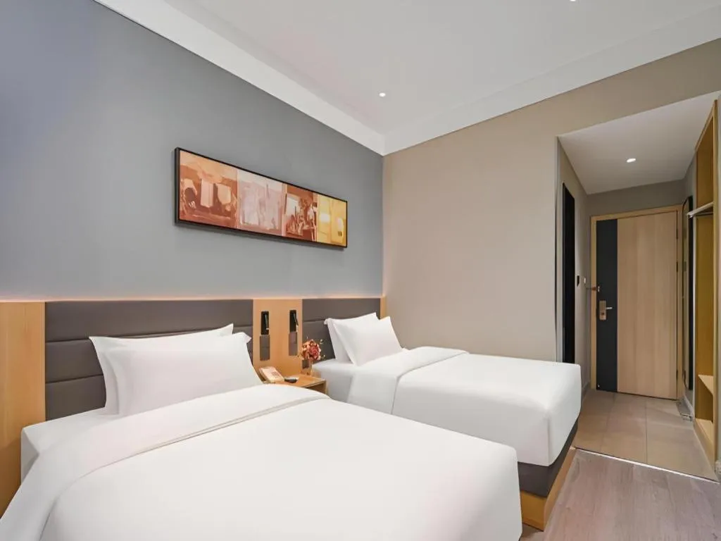 Bed in Jinjiang Inn Wuxi Liangqing Road Wanda Plaza Yunhe Bay Industrial Center