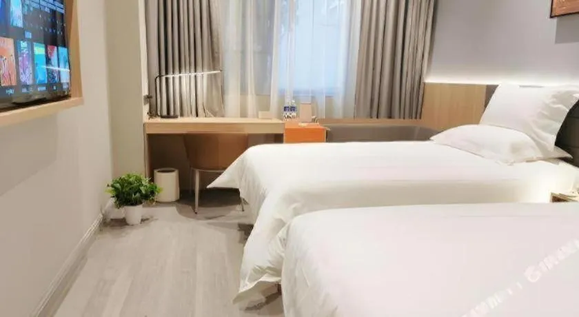 Bed in Jinjiang Inn Wuxi Liangqing Road Wanda Plaza Yunhe Bay Industrial Center