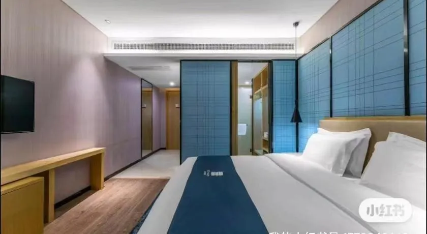 Bed in Echarm Hotel Wuhan Changjiang New District Gaoche Metro Station