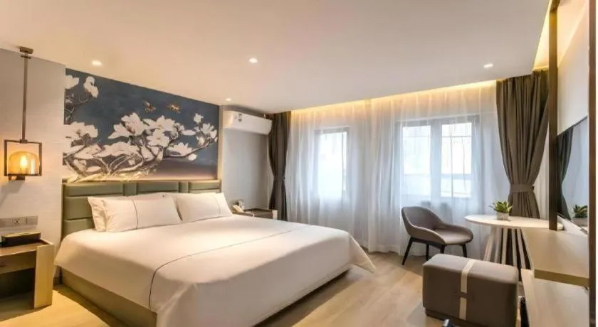 Bed in Magnotel Hotel Suzhou Shiquan Street Wangshiyuan