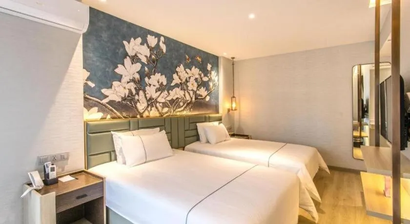 Bed in Magnotel Hotel Suzhou Shiquan Street Wangshiyuan