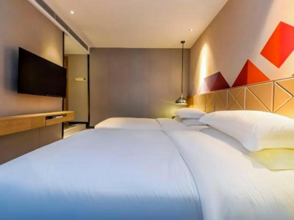 Bed in Borrman Hotel Guangzhou Quzhuang Metro Station