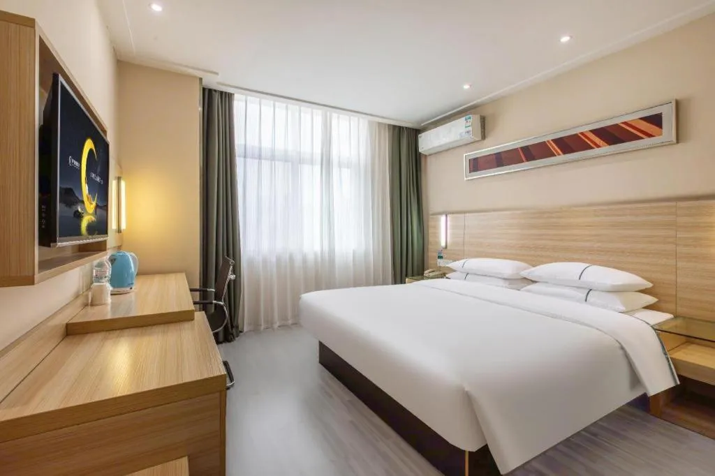 Bed in City Comfort Inn Wuhan Fengshu Er Road Baijin Mansion