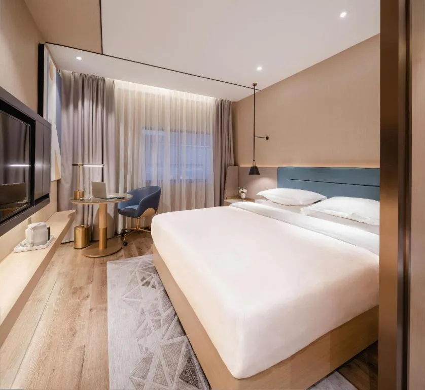 Bed in ZMAX Hotels Shenzhen Lianhuacun Metro Station