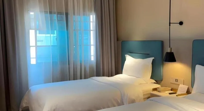 Bed in ZMAX Hotels Shenzhen Lianhuacun Metro Station