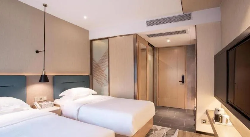 Bed in ZMAX Hotels Shenzhen Lianhuacun Metro Station