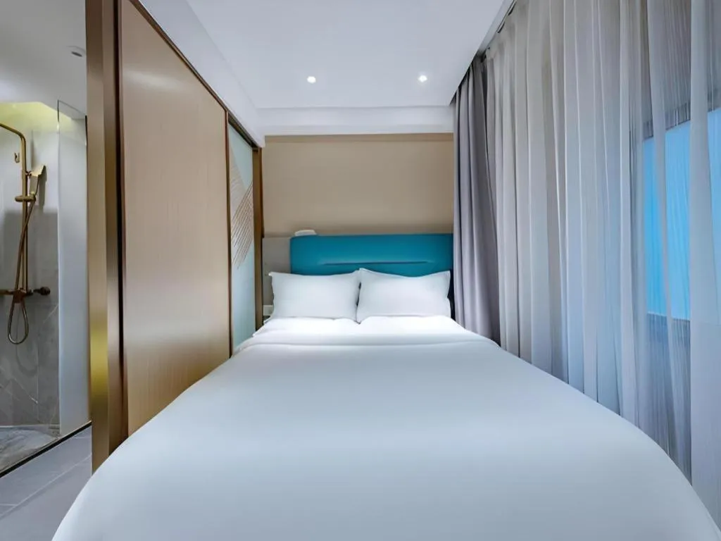 Bed in ZMAX Hotels Shenzhen Lianhuacun Metro Station