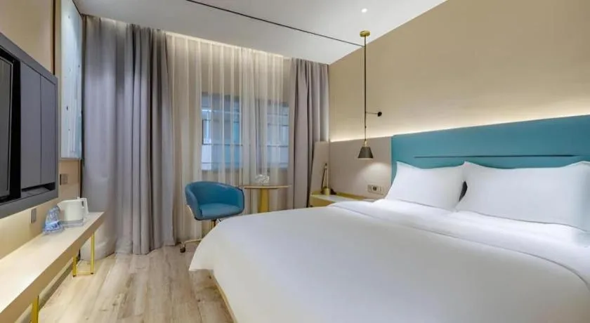 Bed in ZMAX Hotels Shenzhen Lianhuacun Metro Station